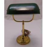 A brass desk lamp with green glass shade on raised circular base, 36.5cm (h)