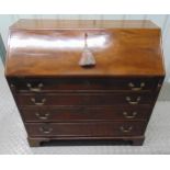 A 19th century rectangular mahogany bureau , the four drawers with brass swing handles on four