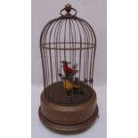 An automaton of two singing birds in a cage of customary form, 27.5cm (h)