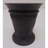 Wedgwood black basalt vase decorated with classical figures in a garden setting, marks to the