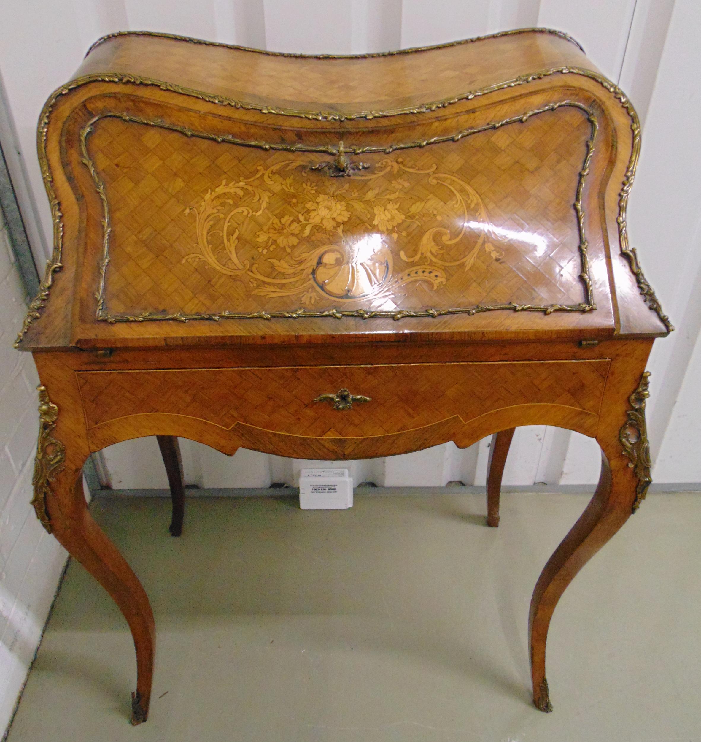 A French 19th century satinwood bureau de dame, the bombe hinged cover and sides with marquetry