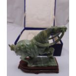 An oriental hard stone carved figurine of a horse with hardwood stand in original case, 32cm (h)