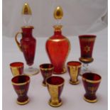 A Murano glass red and gilt Kiddush set to include decanter and stopper and six Kiddush cups