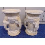 A pair of oriental ceramic garden seats with stylised elephant heads supporting circular tops on