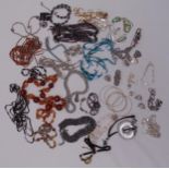 A quantity of costume jewellery to include necklaces, bracelets and bangles