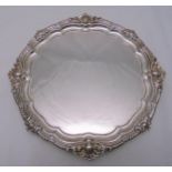 Goldsmiths and Silversmiths hallmarked silver salver with gadroon and shell border on four volute