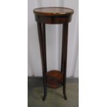 A mahogany circular plant stand on four tapering rectangular supports, 99 x 29.5cm