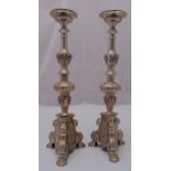 A pair of silver plated pricket candle holders, knopped stems on raised triform bases, 60.5cm (h)