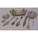 A quantity of white metal to include dishes, a pair of tongs and pill box (10)