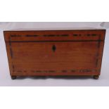 A Victorian rectangular tea caddy with hinged cover revealing fitted interior on four ball feet,