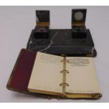 A rectangular marble ink stand with two square inkwells with hinged covers and an Art Deco desk pad,