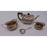 A hallmarked silver teapot, sugar bowl, cream jug and a tea strainer, approx total weight 699g