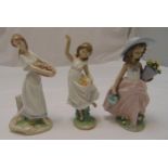 Three Lladro figurines of girls with flowers, marks to the bases, tallest 25cm (h)