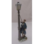 Lladro figurine of a lamplighter lighting a street lamp, marks to the base, 47cm (h)
