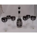 A set of six hock glasses and a matching decanter with drop stopper