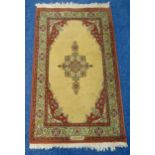 A Middle Eastern rectangular wool carpet, central geometric form within stylised leaf and floral