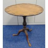 A 19th century mahogany piecrust tilt top occasional table on three outswept legs, 70 x 64cm