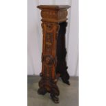 A continental oak plant stand of rectangular section profusely carved with animals shells and