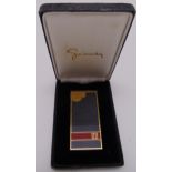 Givenchy enamel and gilded metal cigarette lighter in original packaging