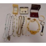 A quantity of costume jewellery to include necklaces, brooches, bracelets and earrings