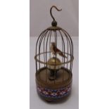 A bird in a cage automaton clock with cloisonne‚ base in three bracket feet, 22cm (h) A/F