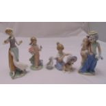 Five Lladro figurines of children, a cat and dog, marks to the bases, tallest 23.5cm (h)