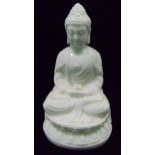 An oriental blanc de chine figurine of Guanyin on raised lotus base, 17cm (h)