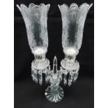 Baccarat a two branch candelabrum with crystal drops and storm lantern shades on fluted circular