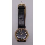 Omega De Ville 9ct gold gentlemans wristwatch on a replacement leather strap