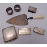 A quantity of hallmarked silver to include a presentation trowel, a cigarette case, a snuff box, a