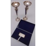 A pair of hallmarked silver vases A/F and a hallmarked silver ingot in fitted case with COA