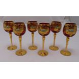 A set of six Venetian hand painted red wine glasses on circular spreading bases with gilded