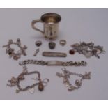 A quantity of silver jewellery to include rings, charm bracelets, an identity chain and a hallmarked