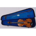 A childs violin and bow in fitted case