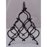 A cast iron wine bottle stand of pyramid for form with swing handle, 48cm (h)