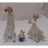 Three Lladro figurines of girls with butterflies and cats, marks to the bases, tallest 32cm (h)