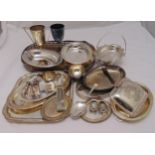 A quantity of silver plate to include gallery trays, condiments, and a bread basket