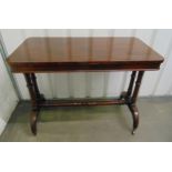 A 19th century mahogany rectangular serving table, supported by four cylindrical columns on scroll