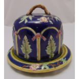 A majolica cheese dome in the Minton style, decorated with leaves and flowers, 25cm (h)
