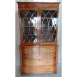 A 19th century mahogany breakfront bookcase with astral glazed double door cupboard, five drawers