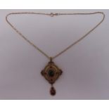 9ct yellow gold pendant/brooch set with garnets on a 9ct yellow gold chain, approx total weight 20.