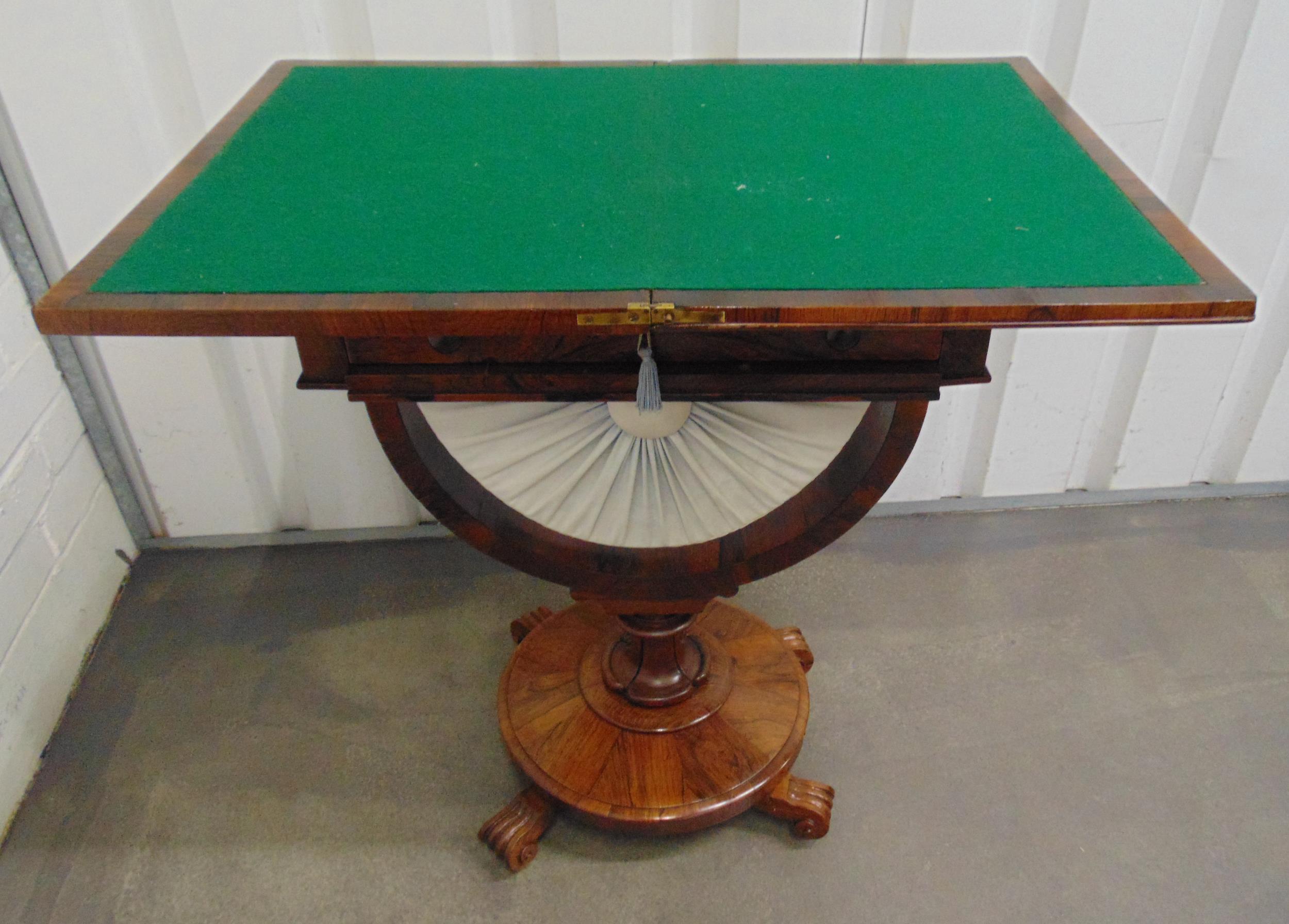 A Victorian mahogany sewing table cum games table on raised circular base with scroll feet, 75 x - Image 2 of 2