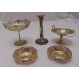 A quantity of silver to include a tazza, a nut dish, two bonbon dishes and a candlestick