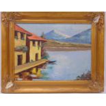 Garini framed oil on canvas of houses by a lake with snow capped mountains in the background, signed