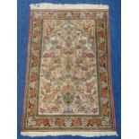 A Middle Eastern Tree of Life silk carpet with repeating floral border, 174 x 110cm