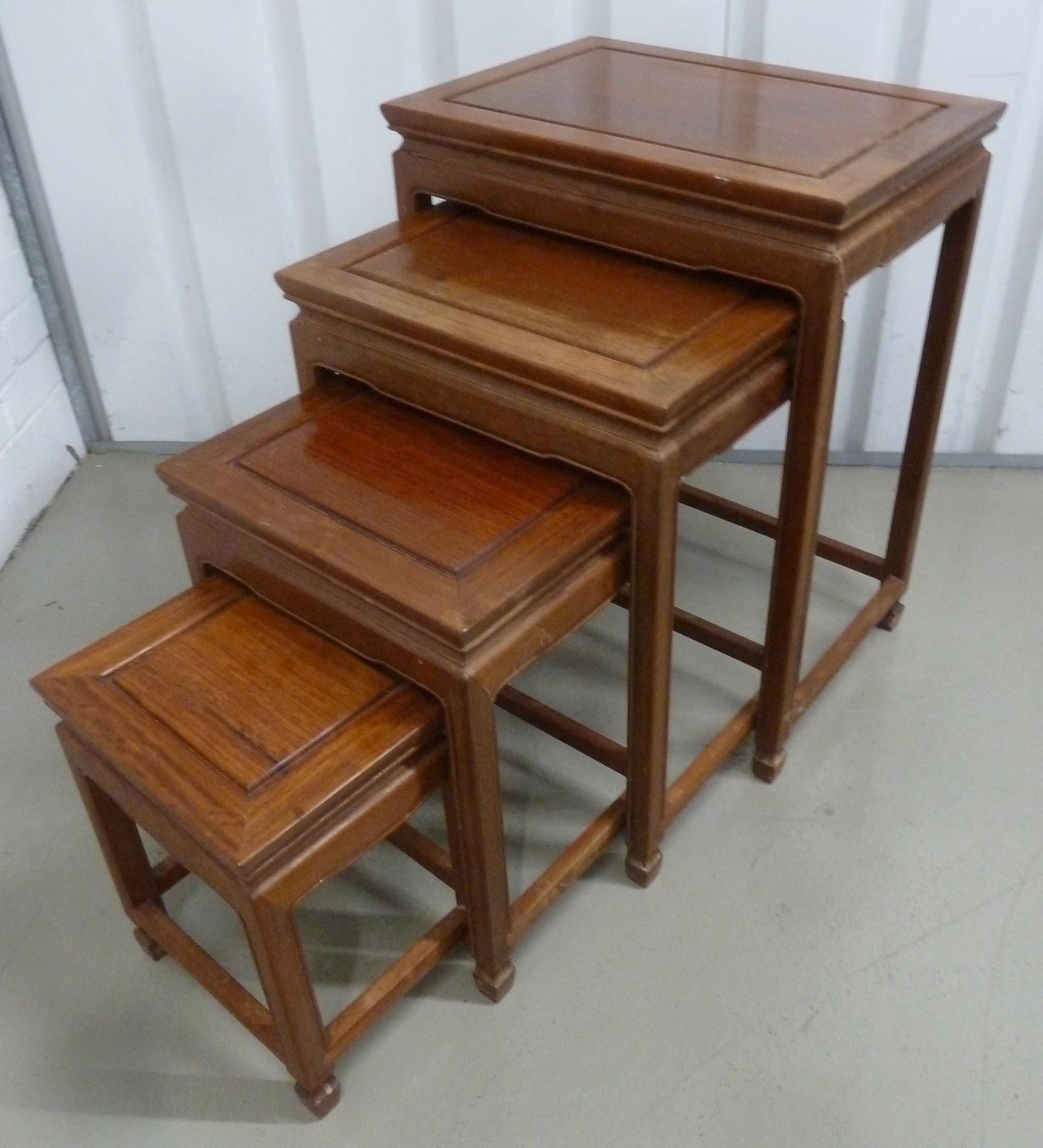 A Chinese rectangular hardwood nest of four tables, tallest 66 x 51 x 36cm