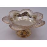 A hallmarked silver shaped circular fruit stand, scroll pierced, the raised circular base with