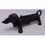 A cast iron door stop in the form of a dachshund, 11.5 x 35 x 13.5cm