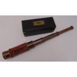 An early 20th century three draw hexagonal brass telescope in wooden fitted case