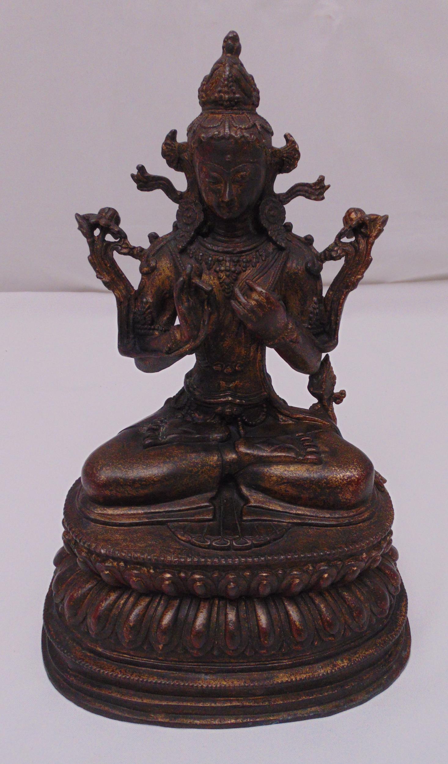 A Tibetan gilded bronze figurine of Buddha on raised lotus base, 35cm (h)